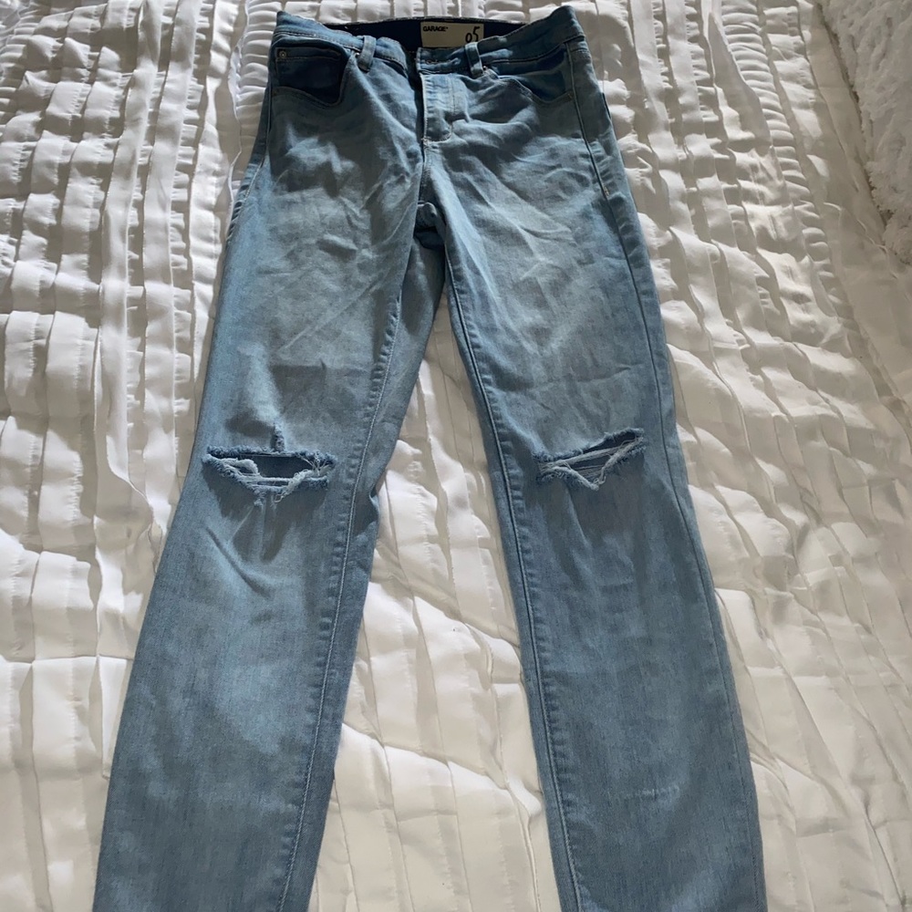 Ripped at the knee jeans